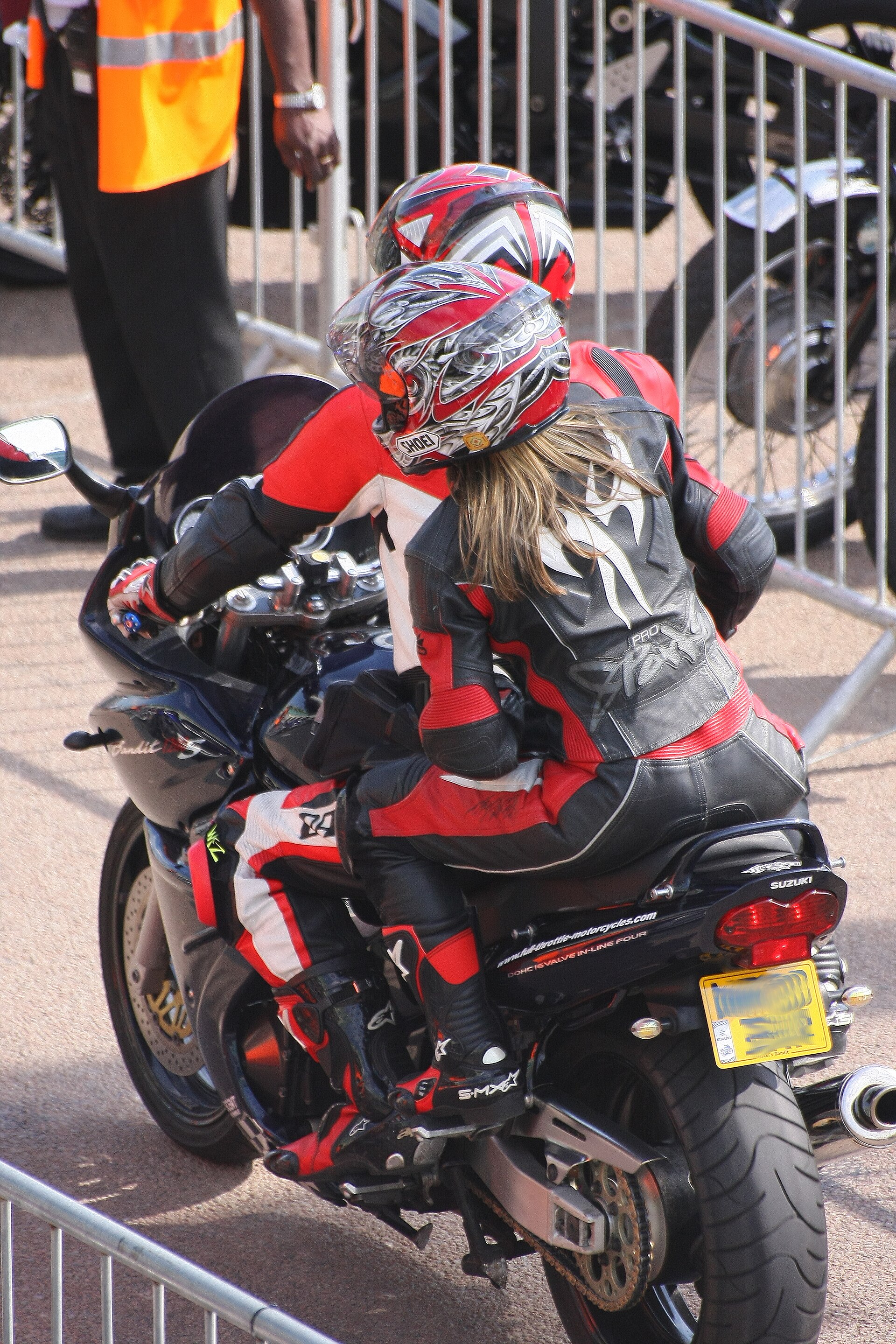 Two riders wearing full protective motorcycle equipment